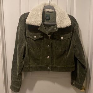Green corduroy jacket with faux fur collar.